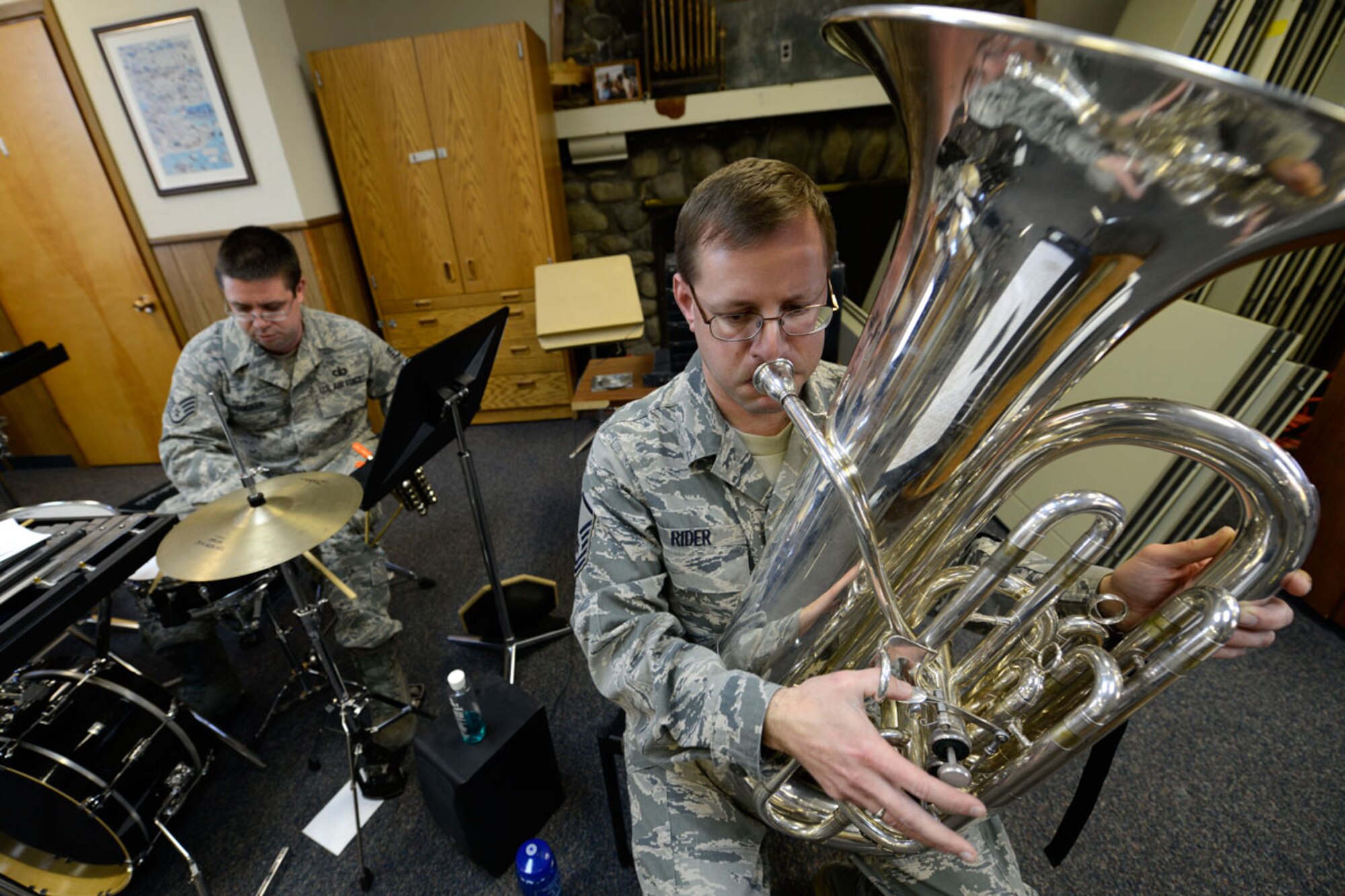 Air Force Staff Sgt. Andrew Tucker and Air Force Master Sgt. John Rider, members of the U.S. Air Force Band of the Pacifi c’s Alaska Brass Band, practice Nov. 20 at JBER for an upcoming Sounds of the Season concert to be hosted at the Atwood Concert Hall Dec. 3 and 4. (U.S. Air Force photo by Tammie J. Ramsouer)