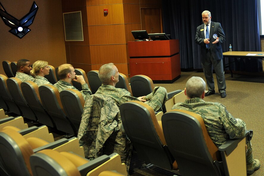 Michael Dunn, with the 55th Force Support Squadron, addresses the crowd about resolving debt issues during Wingman Day in Air Force Weather Squadron Auditorium on Offutt Air Force Base, Neb., Nov. 26. . Team Offutt members were participating in various activities and briefings around the base which promoted teamwork and educated the base community on ways to improve their lives mentally, emotionally, physically and spiritually. (U.S Air Force photo by Charles Haymond/Released)