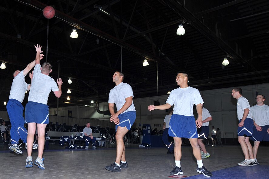 U.S. Air Force Tech. Sgt. Hector Zayas Lugo, with the 55th Strategic Communications Squadron, plays basketball with other squadron members during Wingman Day at the field house on Offutt Air Force Base, Neb., Nov. 26. Team Offutt members were participating in various activities and briefings around the base which promoted teamwork and educated the base community on ways to improve their lives mentally, emotionally, physically and spiritually. (U.S. Air Force photo by Charles Haymond/Released)