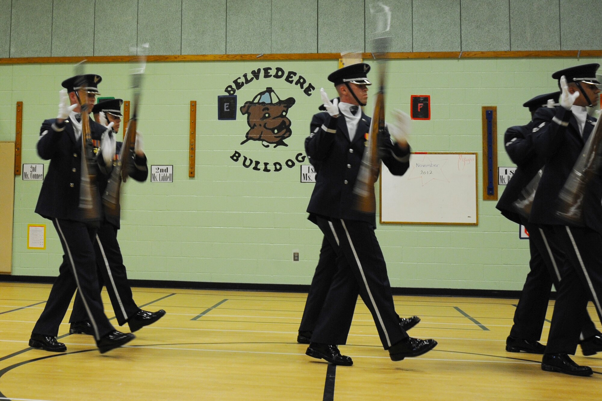 Members of the U.S. Air Force Honor Guard Drill Team toss their bayonetted M-1 rifles during a performance at Belvedere Elementary School in Falls Church, Va., Nov. 26, 2012.   Inspiring patriotism and garnering interest in the U.S. Air Force are key aspects of the Drill Team mission.  (U.S. Air Force photo/Staff Sgt. Torey Griffith)