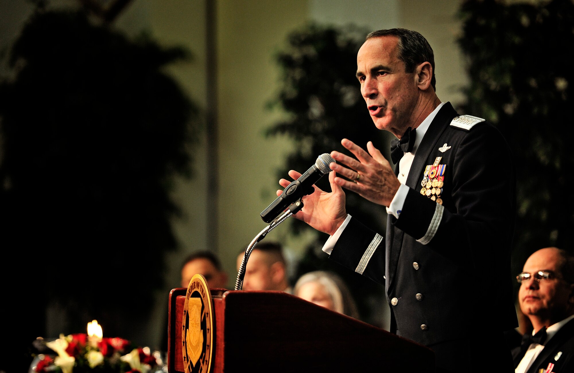 Gen. Raymond E. Johns Jr., Air Mobility Command commander, speaks to the audience about the importance of Airmen during the Order of the Sword ceremony at the Scott Air Force Base Nov. 28, 2012. The Order of the Sword is a special program where noncommisioned officers of a command recognize individuals who have made significant contributions to the enlisted corps. Johns is the 10th AMC commander to be awared this honor. (U.S. Air Force photo/ Staff Sgt. Ryan Crane)