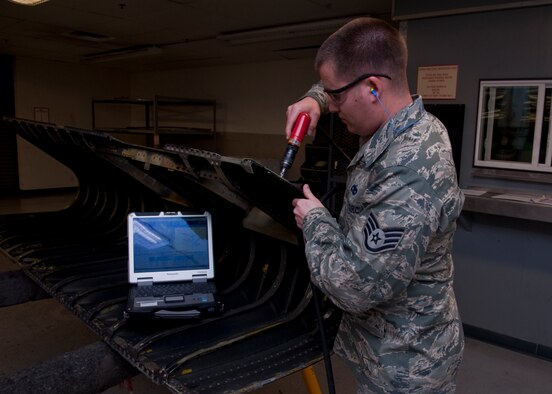 U.S. Air Force Staff Sgt. James B. Smith, aircraft maintenance craftsman of 1st Special Operations Equipment Maintenance Squadron repairs a damaged aircraft wing leading edge in the Eason Hangar at Hurlburt Field, Fla. Nov. 27, 2012. The leading edge is located in the front of the wing and is the first part to make contact with airflow during flight. (U.S. Air Force Photo/ Airman First Class Nigel Sandridge)

