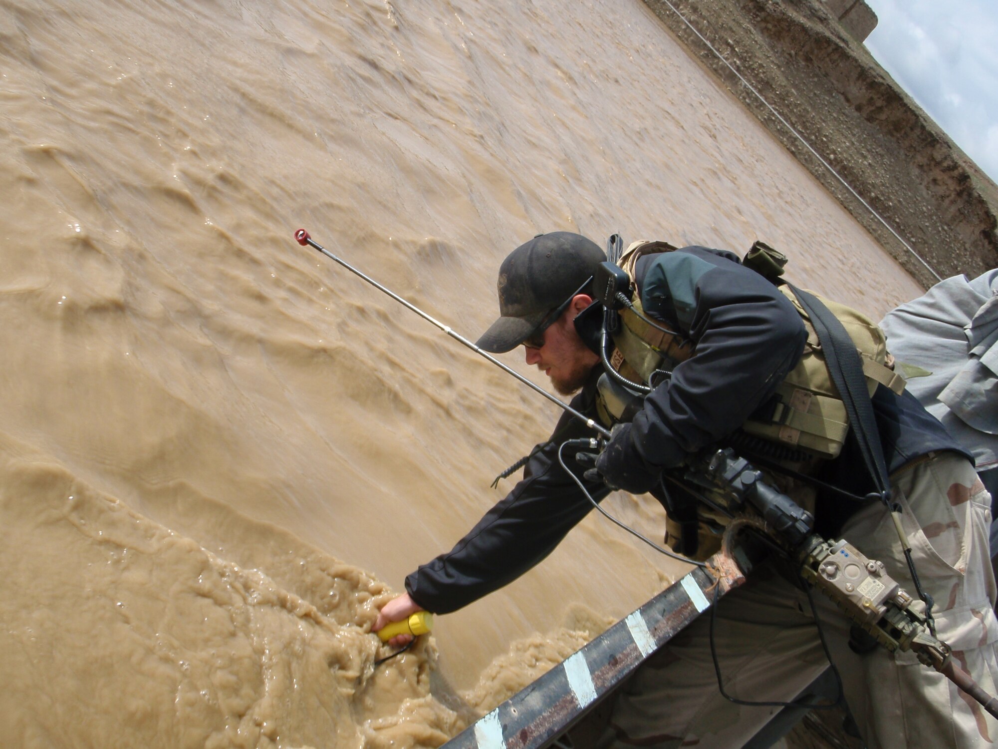 Staff Sgt. Bryce Howser, Special Operations Weather Team member, measures the depth and flow rate of a river in Afghanistan. SOWTs use this data to determine whether or not a river is safe to cross on foot. Howser is now assigned to the 320th Special Tactics Squadron in Kadena, Japan. (courtesy photo)