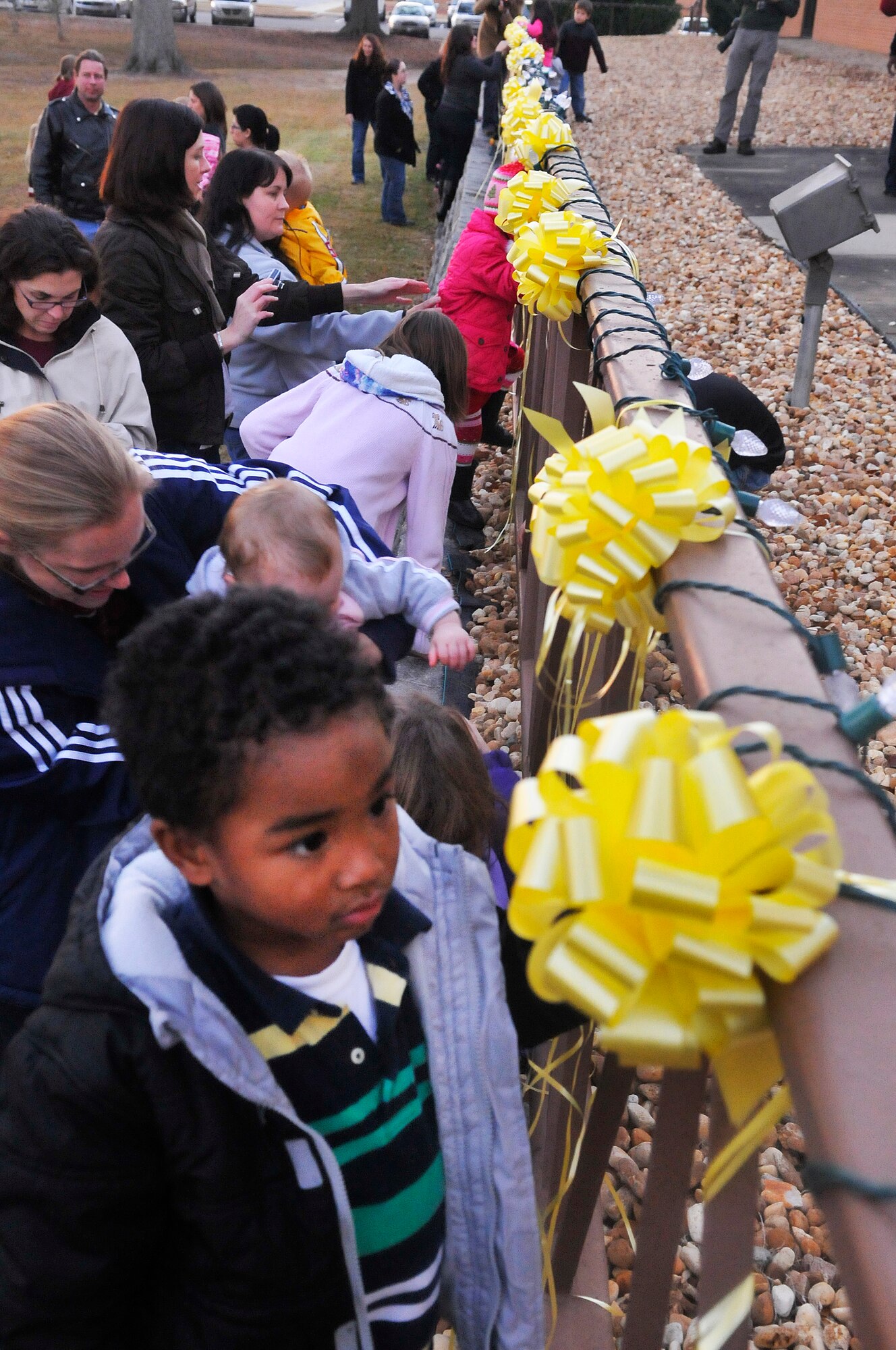 Yellow ribbons are tied to the front rail of the Chapel to honor deployed military. (U. S. Air Force photo/Sue Sapp)