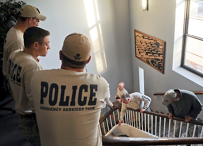 Members of the 2nd Security Forces Emergency Services Team discuss tactical procedures on Barksdale Air Force Base, La., Nov. 28. The team, similar to Special Weapons and Tactics teams, responds to high-risk situations, including hostage situations and felony warrants. (U.S. Air Force photo/Senior Airman Kristin High)
