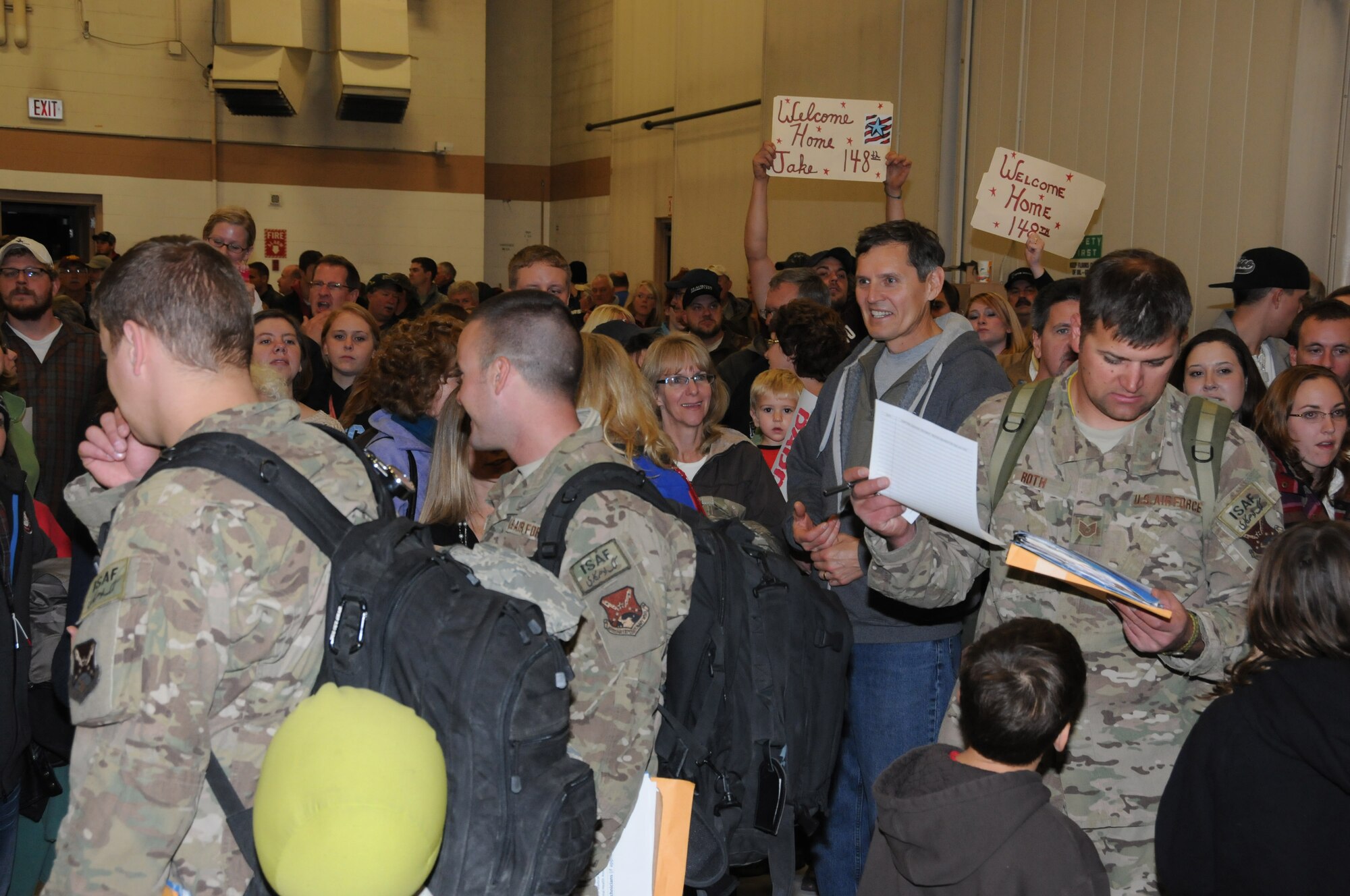 148th Fighter Wing airmen are greeted by family members after returning from a deployment to Kandahar Airfield, Afghanistan, Oct. 25, 2012.  The airmen returned to Duluth, Minn. after serving for over two months in support of Operation Enduring Freedom.  (National Guard by Master Sgt. Ralph J. Kapustka / Released)