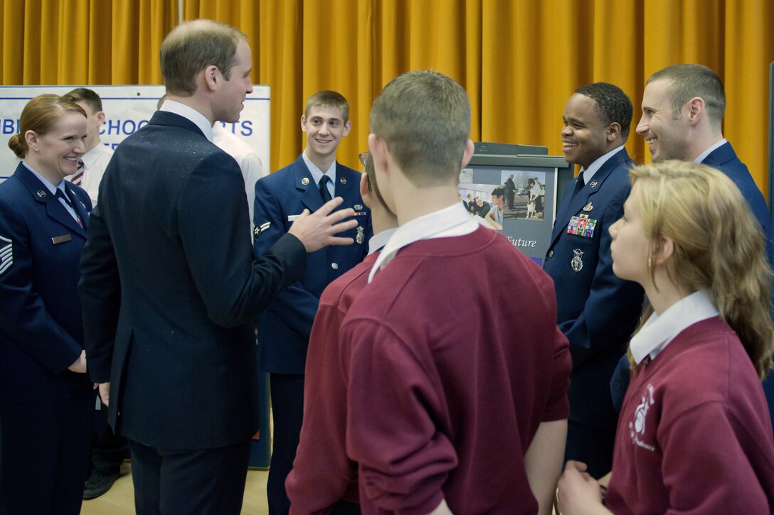CAMBRIDGE, United Kingdom -- Airmen from the 423rd Security Forces Squadron share a laugh with the Duke of Cambridge during the duke and duchess’ first visit to the city of Cambridge. The Airmen spoke with the duke about the mentoring program they established through their honorary commander with The Manor School here. (U.S. Air Force photo by Capt. Brian Maguire)