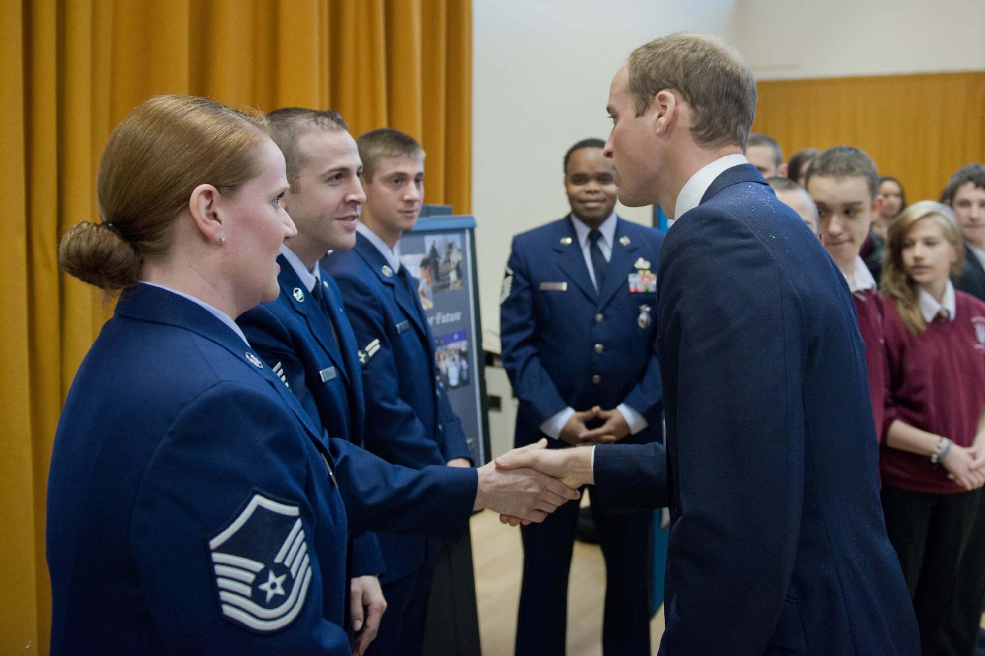 CAMBRIDGE, United Kingdom -- Tech. Sgt. Daniel Baker, 423rd Security Forces Squadron, shakes hands with the Duke of Cambridge during his visit to The Manor School. The Airmen spoke with Prince William about the mentoring program they’ve established through their honorary commander, Julie Spence, the former Chief Constable of Cambridgeshire. (U.S. Air Force photo by Capt. Brian Maguire)