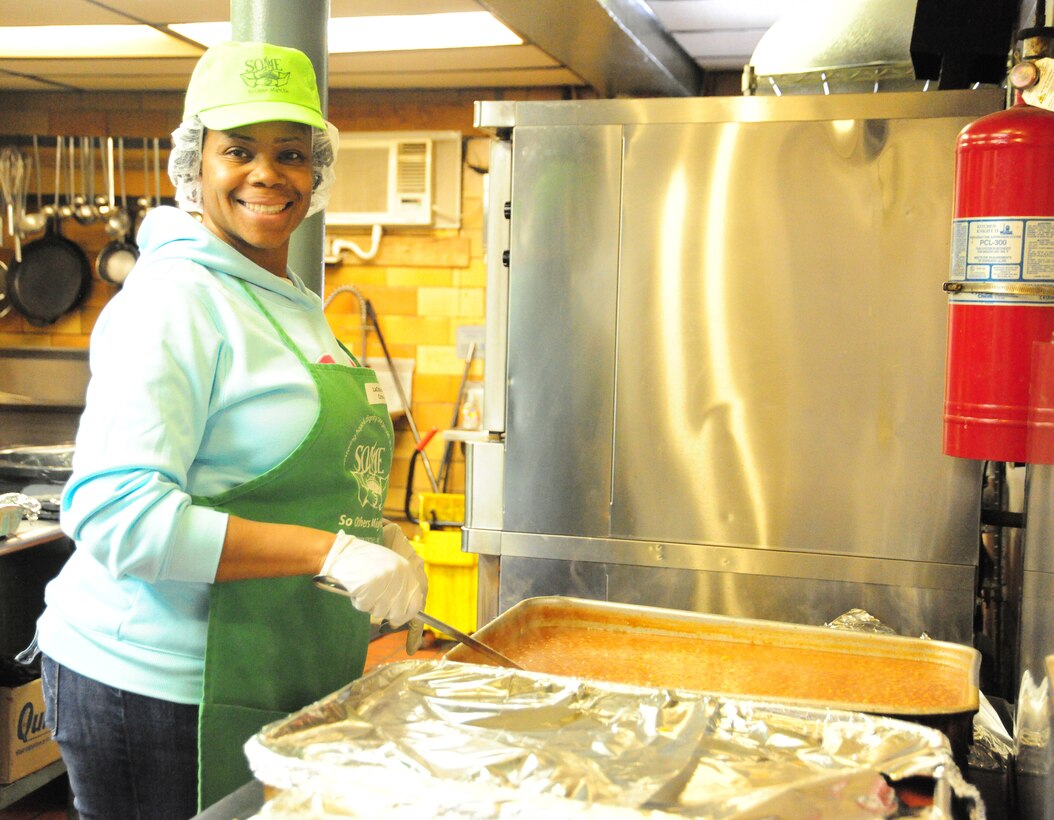 JOINT BASE ANDREWS, Md. - Senior Master Sgt. LaChanda Crowell, Air Force Element Medical DoD here, first sergeant and superintendent, helps prepare food, Nov. 20, 2012, for those in need at charity organization So Others May Eat, SOME. Service members, retirees and dependents from Team Andrews interested in volunteering to help serve a meal to those in need can contact Chapel One at 301-981-2111. (U.S. Air Force photo/ Seniior Airman Amber Russell)