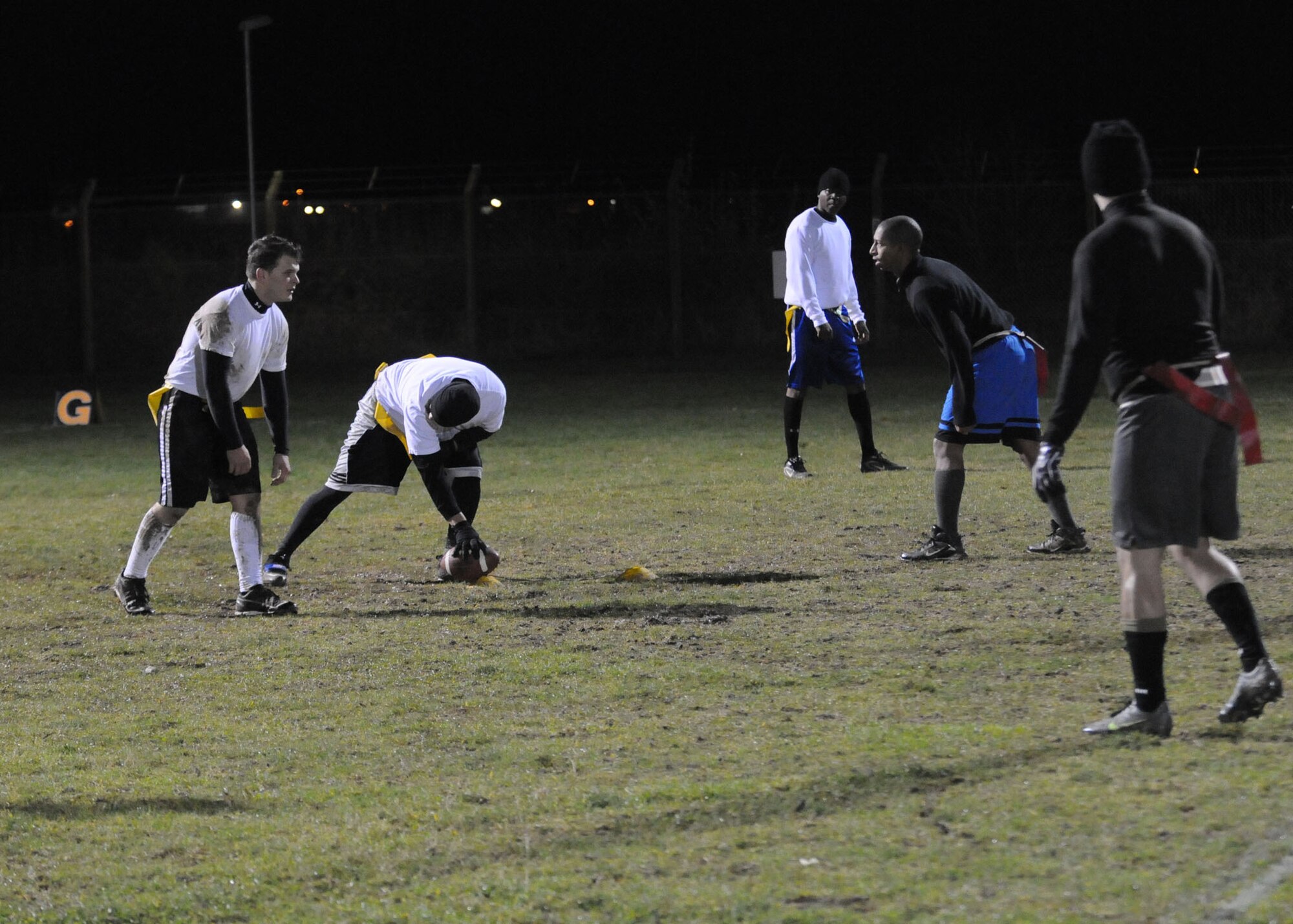 Airman 1st Class Justin Buchanan, 67th Special Operations Squadron radio operator from Robinson, Ill., prepares to throw a football down the field during a flag football game against 488th Intelligence Squadron Nov. 28, 2012, at RAF Mildenhall, England. The game was the first of the flag football play-offs. The championship game is scheduled for Dec. 5, 2012. (U.S. Air Force photo by Airman 1st Class Kelsey A.L. Waters/Released)