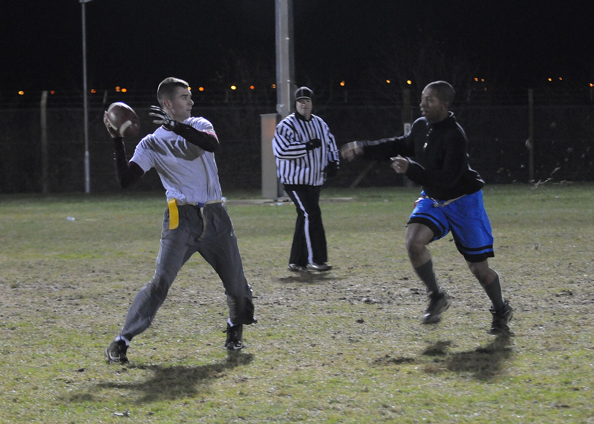 Airman 1st Class Justin Buchanan, 67th Special Operations Squadron radio operator from Robinson, Ill., prepares to throw a football down the field during a flag football game against 488th Intelligence Squadron Nov. 28, 2012, at RAF Mildenhall, England. The game was the first of the flag football play-offs. The championship game is scheduled for Dec. 5, 2012. (U.S. Air Force photo by Airman 1st Class Kelsey A.L. Waters/Released)