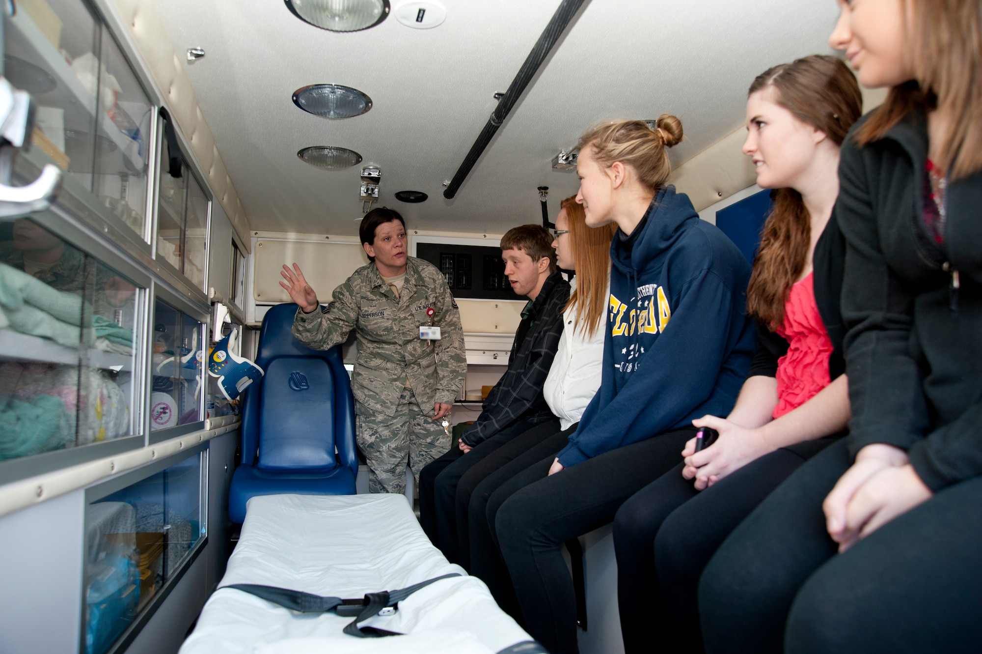 Tech. Sgt. Jean Epperson, 22nd Aerospace Medicine Squadron Flight Medicine NCO in charge, shows McPherson High School students the inside of an emergency response vehicle Nov. 28, 2012, McConnell Air Force Base, Kan. The students, who are interested in pursuing medical careers, toured the 22nd Medical Group facilities to learn more about the various positions in the military. (U.S. Air Force photo/Airman 1st Class Victor J. Caputo)