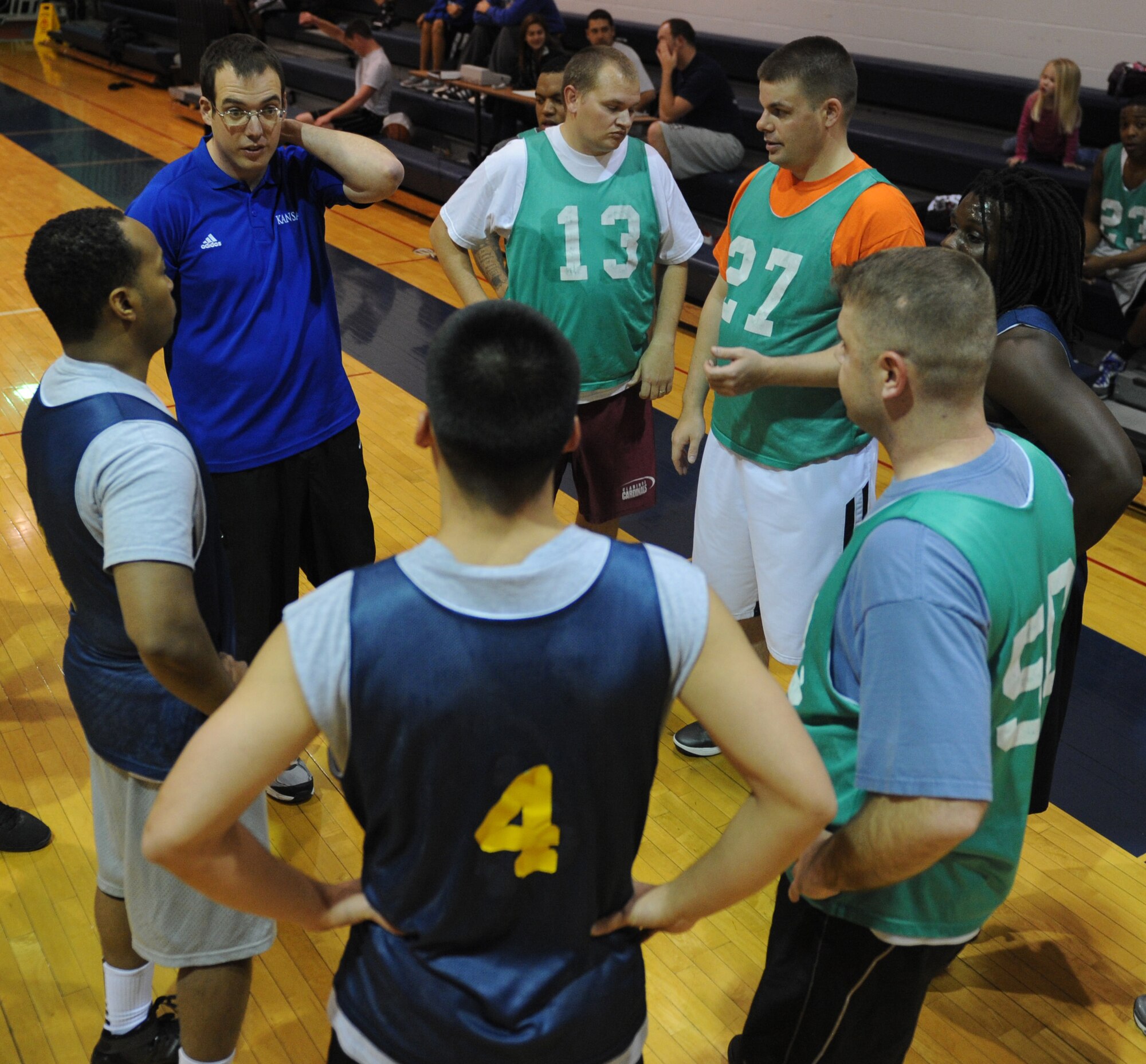 Members of the 509th Operations Support Squadron basketball team discuss their offensive gameplan during their game against the 23rd Fighter Group Nov. 27 at Whiteman Air Force Base, Mo. OSS defeated the 23rd FG 60-49. (U.S. Air Force photo/Airman 1st Class Bryan Crane) (Released)