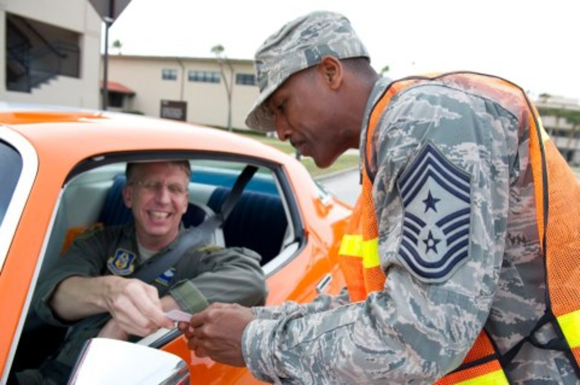During a holiday safety campaign, Col. Jeffrey Macrander, commander, 920th Rescue Wing received a safety reminder from Chief Master Sgt. Herman Moyer, wing command chief, 45th Space Wing.