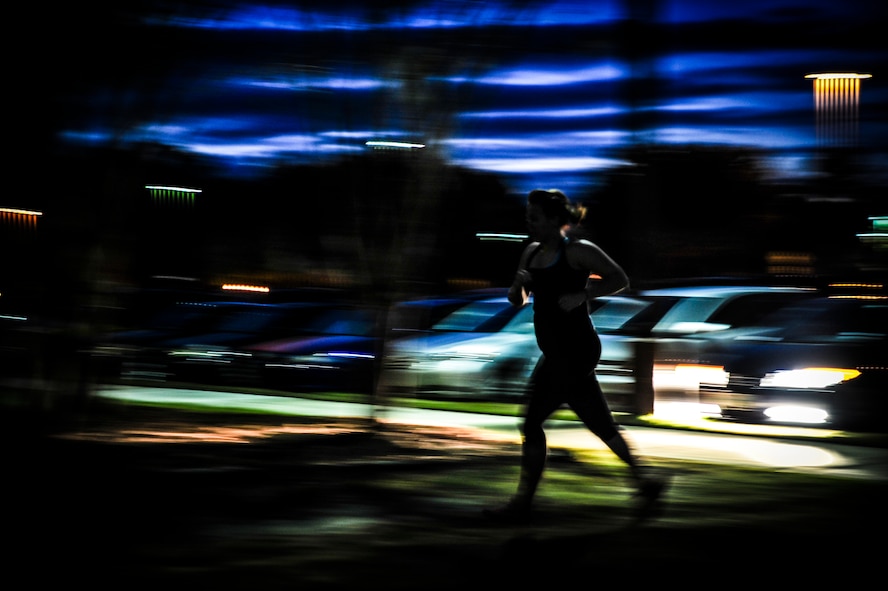 A CrossFit participant runs back to the gym after completing a 400-meter sprint during a CrossFit class Nov. 19, 2012, at the Joint Base Charleston, S.C., Fitness Center. CrossFit uses random physical challenges so each workout is varied and high in intensity. (U.S. Air Force photo/ Senior Airman Dennis Sloan)