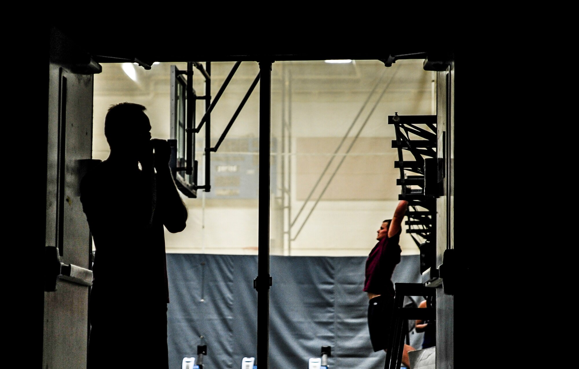 Senior Airman Michael Sellers, a volunteer CrossFit coach from the 315th Airlift Wing, motivates runners during a CrossFit class Nov. 19, 2012, at the Joint Base Charleston – Air Base Fitness Center. CrossFit uses random physical challenges so each workout is varied and high in intensity.  (U.S. Air Force photo/ Senior Airman Dennis Sloan)