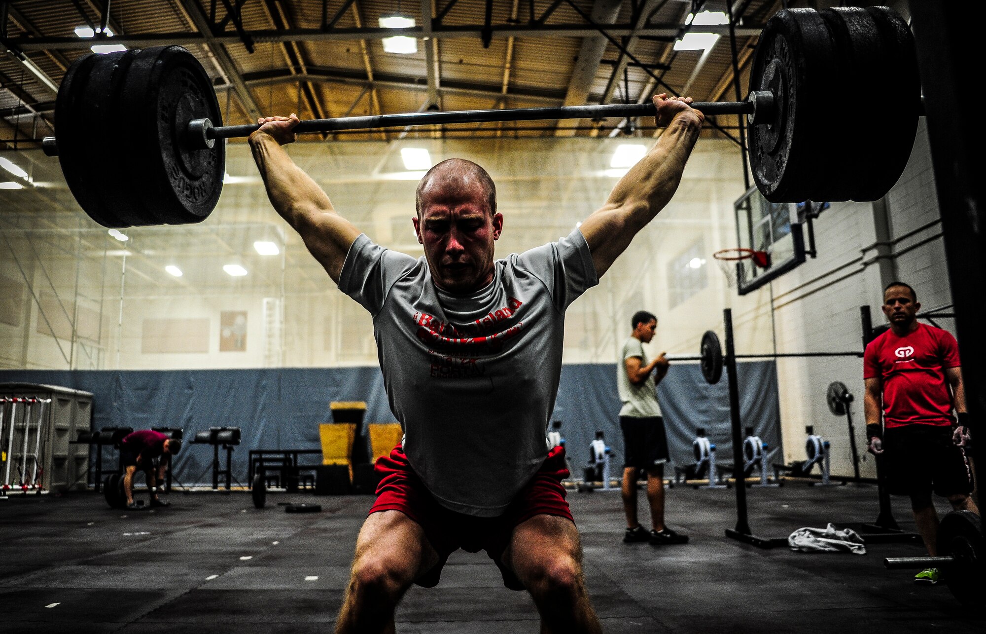 Senior Airman Joseph Schlank, 437th Aerial Port Squadron passenger terminal attendant, performs a power clean during a CrossFit class Nov. 19, 2012, at the Joint Base Charleston – Air Base Fitness Center. The CrossFit classes can accommodate individuals with different strength abilities and experience and there is always someone on hand to assist with proper form and technique. (U.S. Air Force photo/ Senior Airman Dennis Sloan)