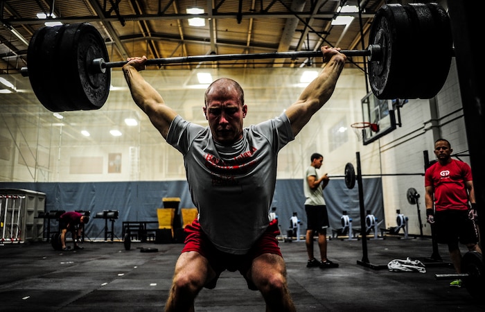 Senior Airman Joseph Schlank, 437th Aerial Port Squadron passenger terminal attendant, performs a power clean during a CrossFit class Nov. 19, 2012, at the Joint Base Charleston – Air Base Fitness Center. The CrossFit classes can accommodate individuals with different strength abilities and experience and there is always someone on hand to assist with proper form and technique. (U.S. Air Force photo/ Senior Airman Dennis Sloan)