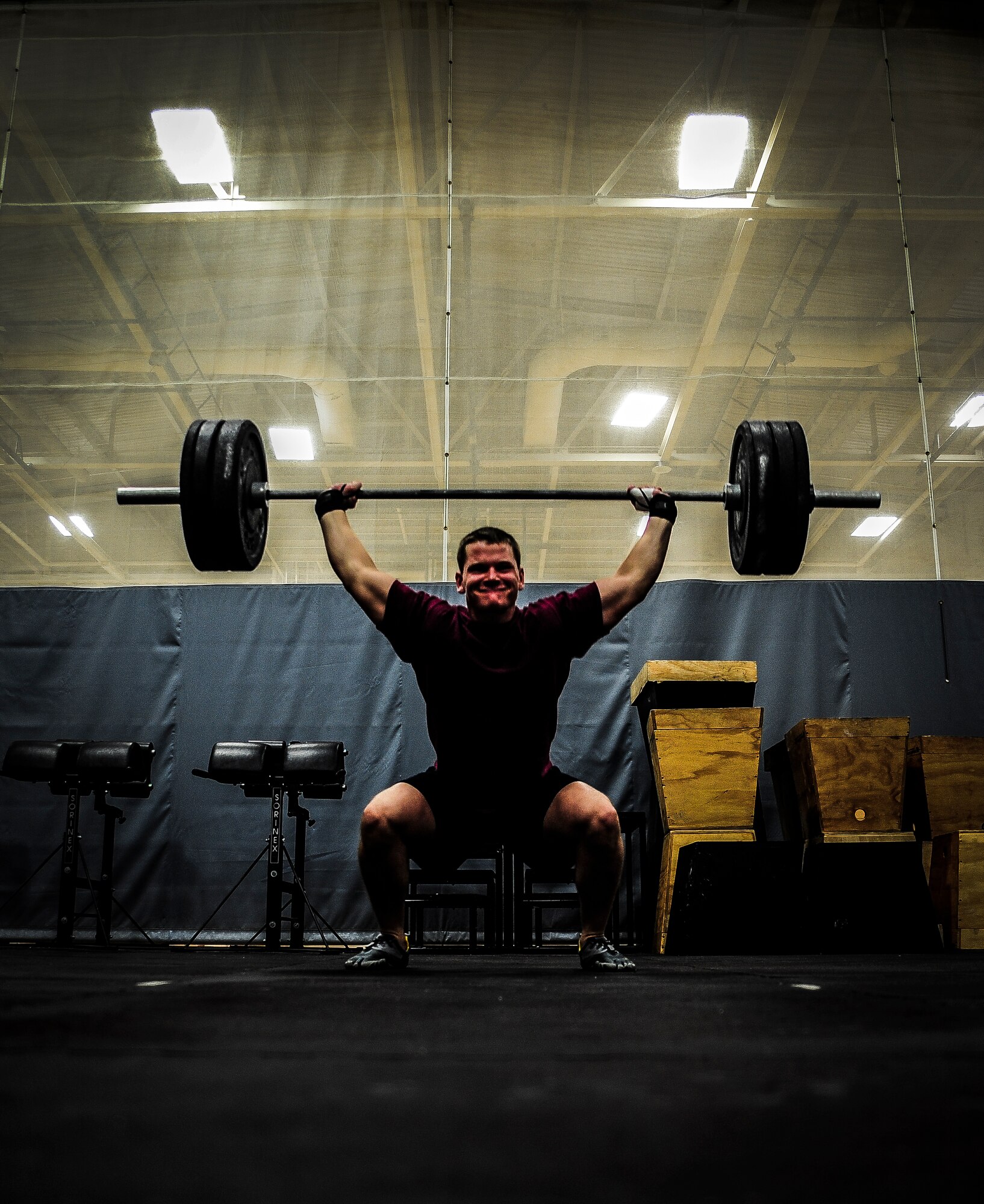 Airman 1st Class Andy Sims, 437th Maintenance Squadron crew chief, performs a power clean during a CrossFit class Nov. 19, 2012, at the Joint Base Charleston – Air Base Fitness Center. The CrossFit classes can accommodate individuals with different strength abilities and experience and there is always someone on hand to assist with proper form and technique. (U.S. Air Force photo/ Senior Airman Dennis Sloan)