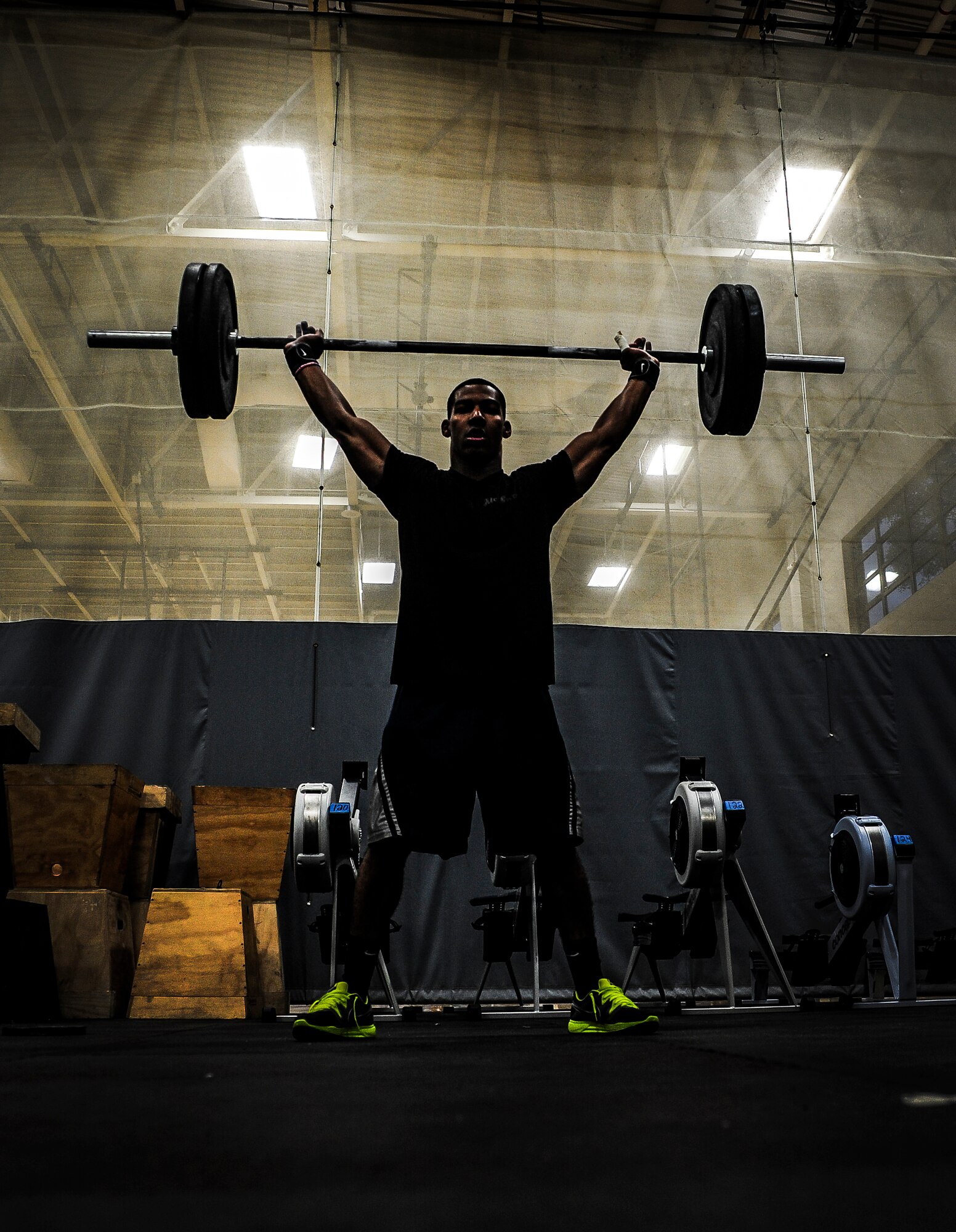 Airman 1st Class Jacob Allen, 437th Aircraft Maintenance Squadron crew chief, performs a power clean during a CrossFit class Nov. 19, 2012, at the Joint Base Charleston – Air Base Fitness Center.  Individuals perform several repetitions of each exercise, increasing or decreasing the weight as they progress through their workout. (U.S. Air Force photo/ Senior Airman Dennis Sloan)