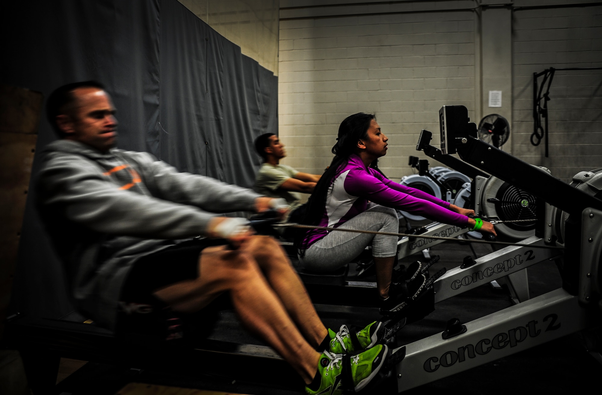 CrossFit participants , power through a workout while performing a rows during a class Nov. 19, 2012, at the Joint Base Charleston – Air Base Fitness Center. The CrossFit classes are held three times a day every Monday through Friday starting at 6 a.m., noon and 5 p.m. A class is also held Saturday at 10 a.m. (U.S. Air Force photo/ Senior Airman Dennis Sloan)