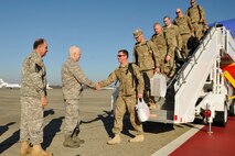 HANSCOM AIR FORCE BASE, Mass. - Command Sgt. Maj. David Costa and Maj. Gen. L. Scott Rice, The Adjutant General (Acting), Massachusetts National Guard, welcome home around 80 Soldiers of the 182nd Engineer Company (Sapper) from a year-long deployment to Afghanistan on the base flightline Nov. 22. The guard also held two separate ceremonies in Florence and Newburyport for family and friends to welcome home the troops. (Photo by Staff Sgt. James C. Lally, Massachusetts National Guard Public Affairs)