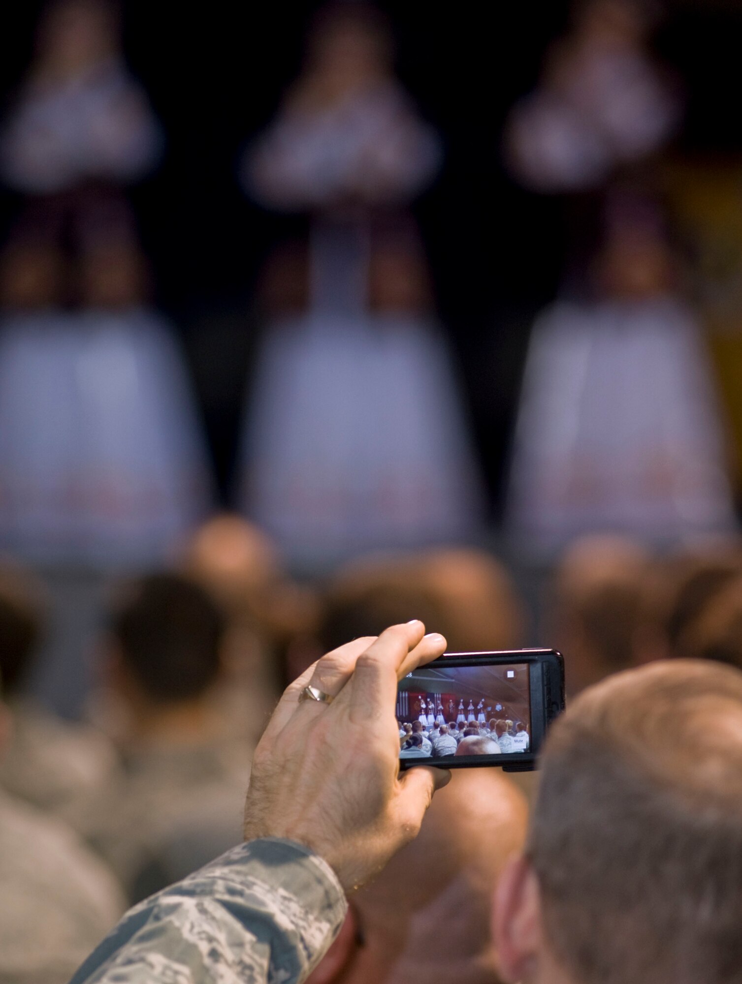 Audience members used cameras and cellular phones to capture the performance from the Mukash Abdraev National School of Music at the Transit Center at Manas, Kyrgyzstan, Nov. 27, 2012.  More than 200 servicemembers attended the free concert held at the Community Activities Center.