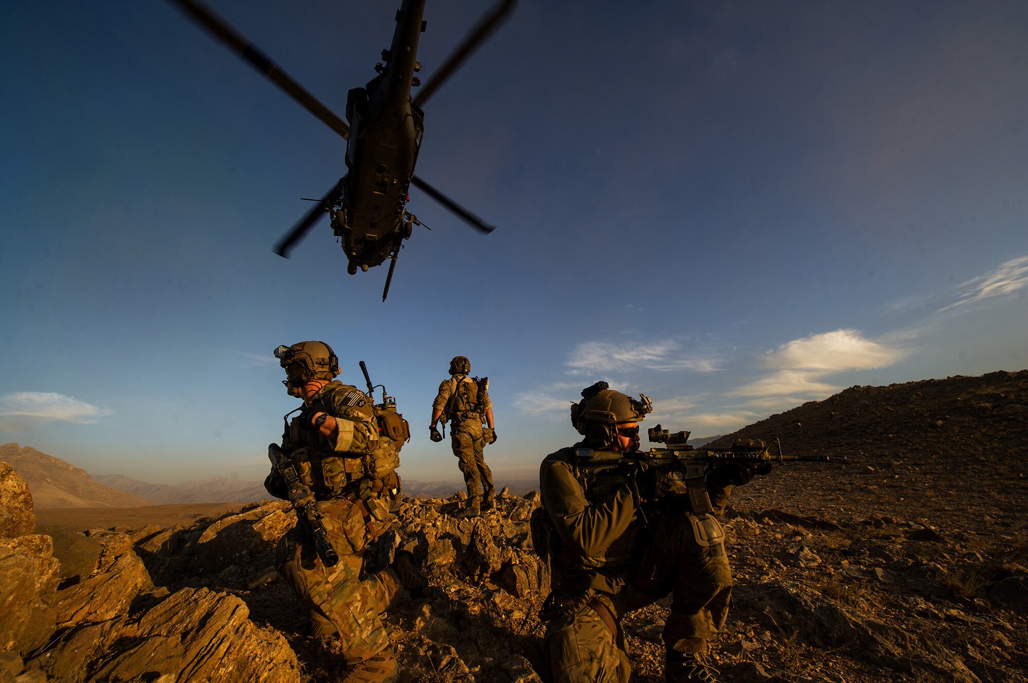 U.S. Air Force pararescuemen, 83rd Expeditionary Rescue Squadron, secure the area after being lowered from a U.S. Air Force HH-60 Pave Hawk during a mission Nov. 7, 2012, in Afghanistan. Pararescue teams assault, secure, and dominate the rescue objective area using any available Department of Department or Allied, air, land, or sea asset. (U.S. Air Force photo/Staff Sgt. Jonathan Snyder)