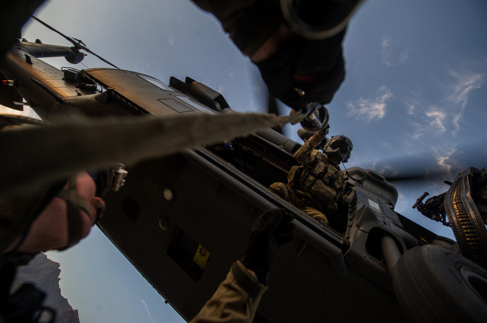 A U.S. Air Force pararescueman, 83rd Expeditionary Rescue Squadron, is hoisted to a U.S. Air Force HH-60 Pave Hawk during a mission Nov. 7, 2012, in Afghanistan. Pararescue teams assault, secure, and dominate the rescue objective area using any available Department of Defense or Allied, air, land, or sea asset. (U.S. Air Force photo/Staff Sgt. Jonathan Snyder)