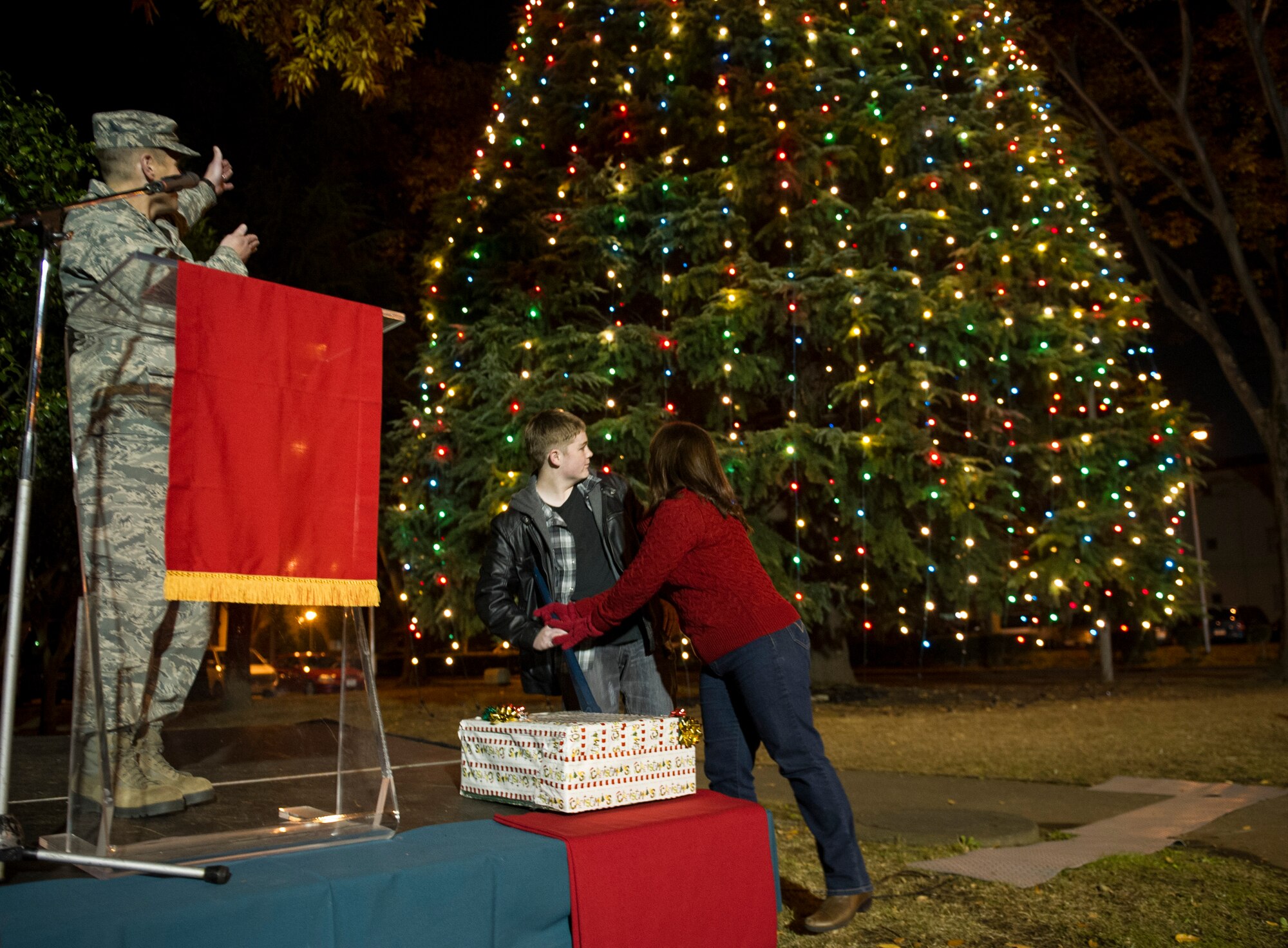YOKOTA AIR BASE, Japan -- Col. Chip Brown, left, 374th Airlift Wing vice commander, counts down to turn on the holiday tree lights at Yokota Air Base, Japan, Nov. 28, 2012. The 374th Civil Engineer Squadron set up the tree lights helping the kick off of this year's holiday season. (U.S. Air Force photo by Senior Airman Andrea Salazar)