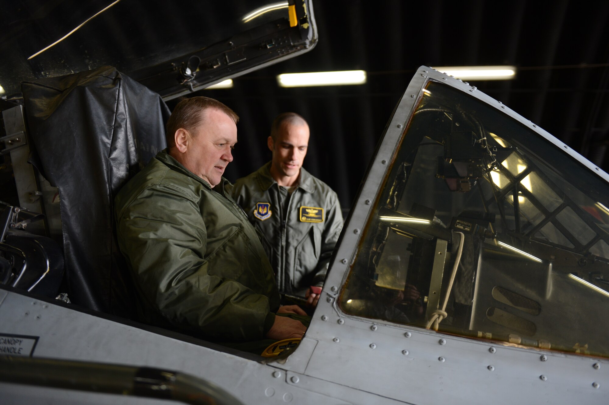 SPANGDAHLEM AIR BASE, Germany – Polish air force Brig. Gen. Wlodzimierz Usarek, left, 2nd Tactical Air Wing commander, studies an A-10 Thunderbolt II cockpit with U.S. Air Force Lt. Col. Clinton Eichelberger, 81st Fighter Squadron commander from Annapolis, Md., on the flightline during a visit to Spangdahlem AB Nov. 27, 2012. Usarek was accompanied by Polish air force Brig. Gen. Tadeusz Mikutel, 1st Tactical Air Wing commander and Col. Kristian Ziec, 32nd Air Base commander during the tour around the base. (U.S. Air Force photo by Airman 1st Class Gustavo Castillo/Released)