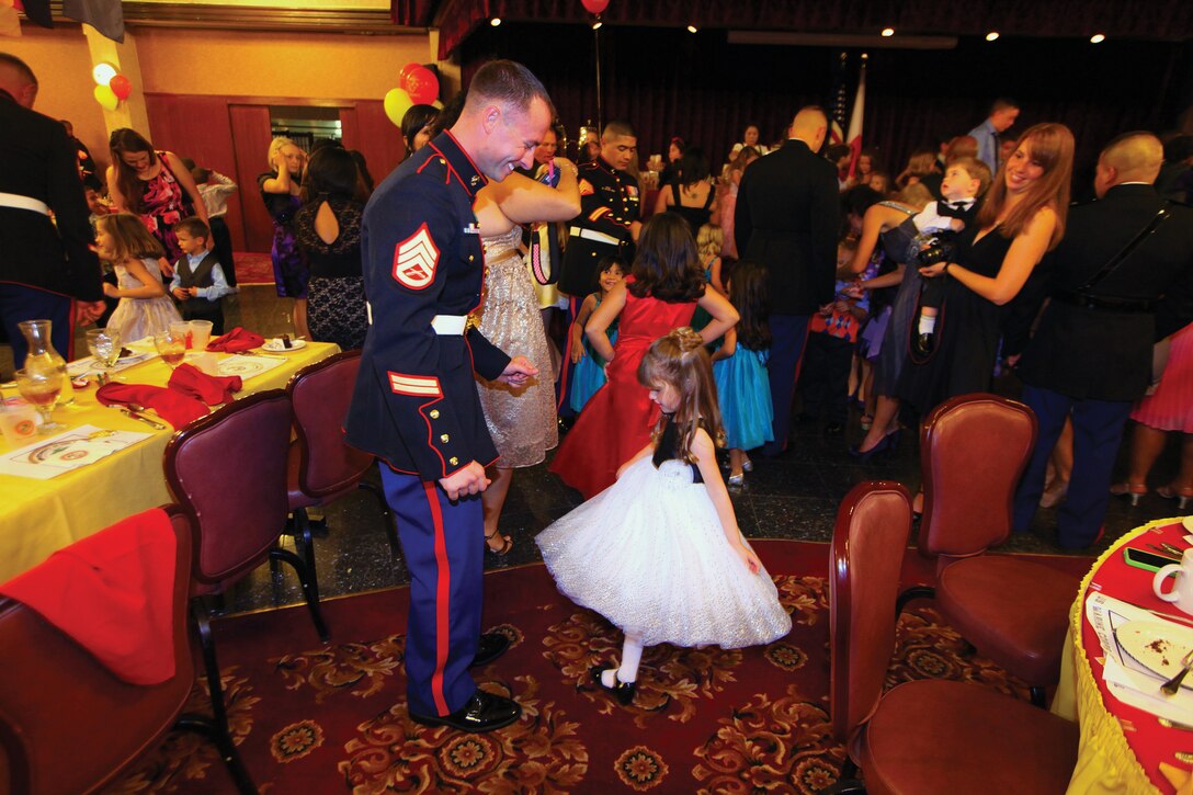 Staff Sgt. Danny L. Barnes Jr. dances with his daughter Cadence Logan during the 3rd Marine Logistics Group children’s ball at the Rocker NCO Club Nov. 16 on Kadena Air Base. Barnes is an explosive ordnance disposal technician with 9th Engineer Support Battalion, 3rd MLG, III Marine Expeditionary Force.