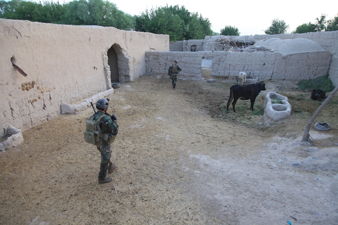 Marines with the 1st Marine Special Operations Battalion, U.S. Marine Corps Forces, Special Operations Command patrol through a compound in Nahr-e Saraj district, Helmand Province April 3. Marines with MARSOC's 1st Marine Special Operations Battalion recently returned from a nine-month deployment to Afghanistan, where they commanded the Special Operations Task Force - West and oversaw one of Afghanistan's bloodiest regions. (U.S. Marine Corps photo by Cpl. Kyle McNally/Not Released)