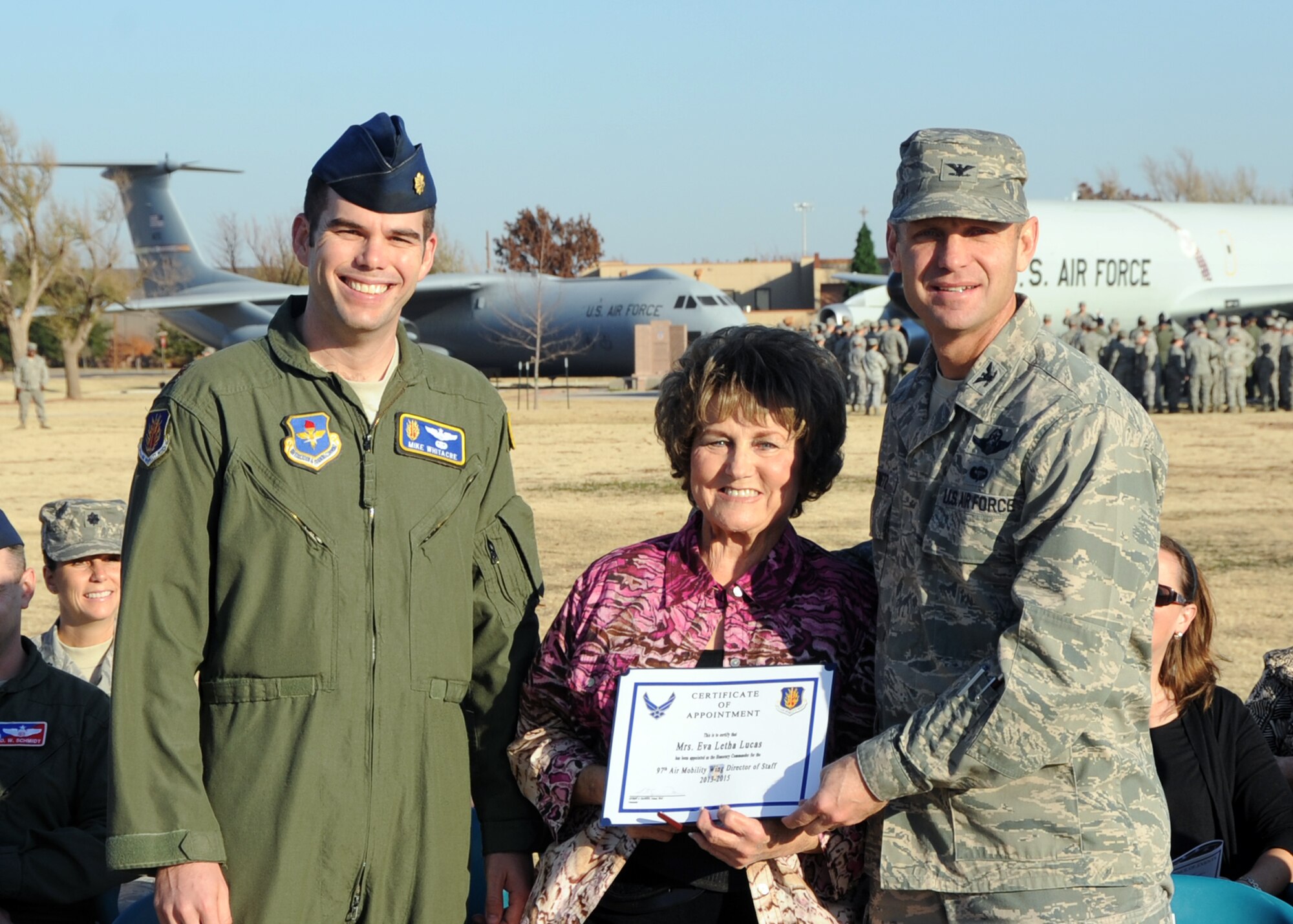 ALTUS AIR FORCE BASE, Okla. – From the left, Maj. Michael Whitacre, 97th Air Mobility Wing Director of Staff, Eva Letha Lucas, Committee of 100 chairman, and Col. Anthony Krawietz, 97th Air Mobility Wing commander, pose for a picture during the Honorary Commander Induction Ceremony at Wings of Freedom Park, Nov. 29, 2012. During the ceremony, Lucas was appointed the Director of Staff Honorary Commander. The purpose of the Honorary Commander program is to foster and strengthen the friendship and partnership between the base and surrounding community. (U.S. Air Force photo by Airman 1st Class Levin Boland / Released)  