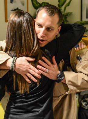 Tech. Sgt. Jeff Austin, 10th Airlift Squadron loadmaster, hugs his wife, Debbie, prior to his deployment, Nov. 29, 2012, at Joint Base Lewis-McChord, Wash. Austin, along with approximately 75 other Airmen from the 10th AS, left for a deployment scheduled to last two months. (U.S. Air Force photo/Staff Sgt. Sean Tobin)