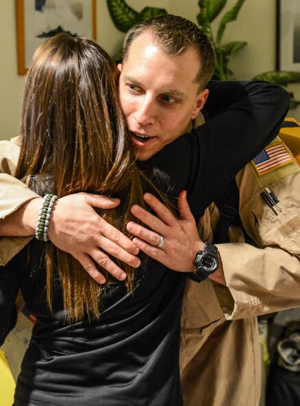 Tech. Sgt. Jeff Austin, 10th Airlift Squadron loadmaster, hugs his wife, Debbie, prior to his deployment, Nov. 29, 2012, at Joint Base Lewis-McChord, Wash. Austin, along with approximately 75 other Airmen from the 10th AS, left for a deployment scheduled to last two months. (U.S. Air Force photo/Staff Sgt. Sean Tobin)