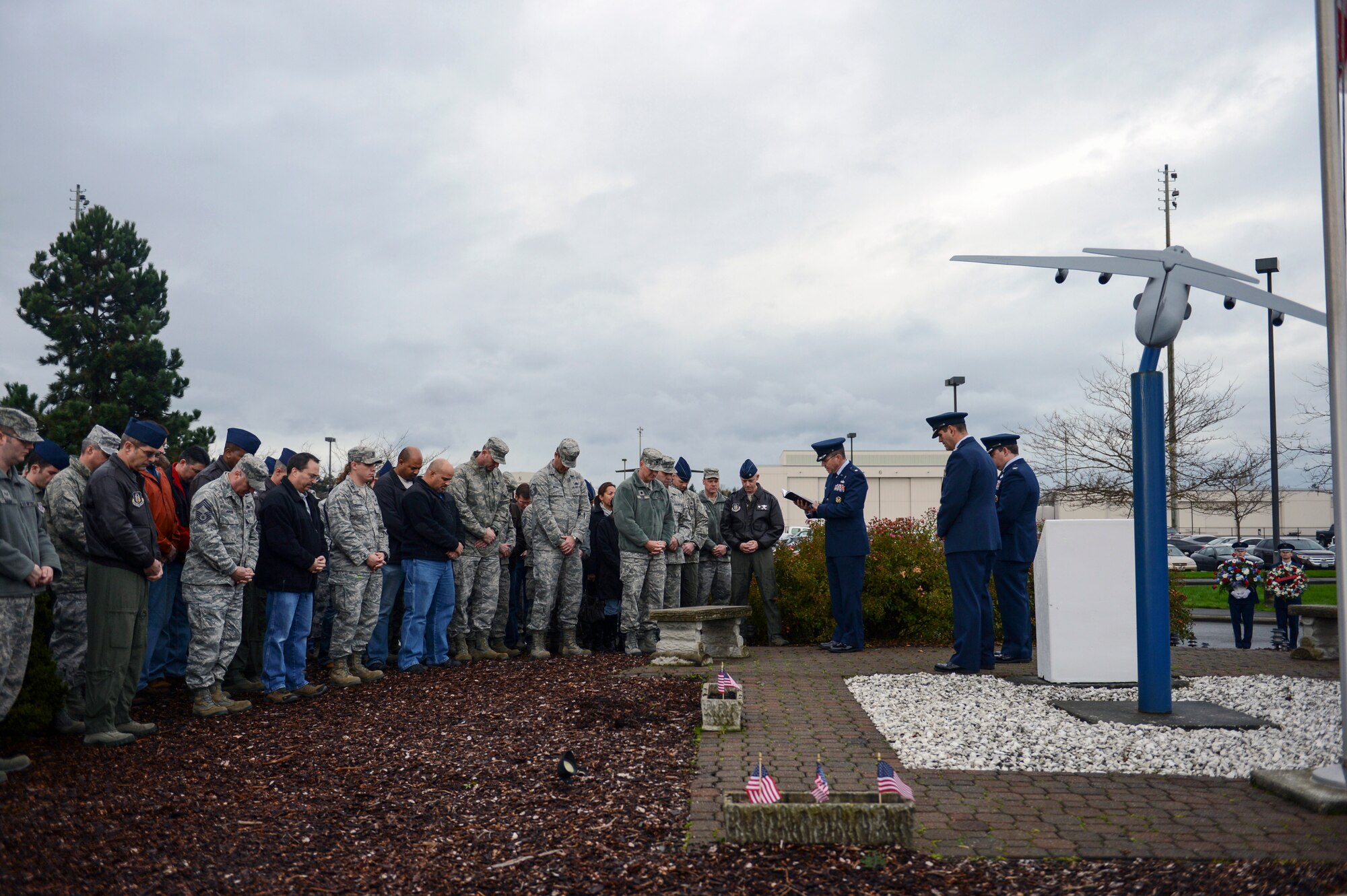 Chap. (Lt. Col.) Matthew Franke, 627th Air Base Group chaplain, provides the invocation during a memorial ceremony Nov. 30, 2012 at Joint Base Lewis-McChord, Wash., to commemorate the 20th anniversary when two C-141 Starlifter aircraft collided over north-central Montana. Franke also read the names of the fallen during the ceremony. (U.S. Air Force photo/Staff Sgt. Frances Kriss)