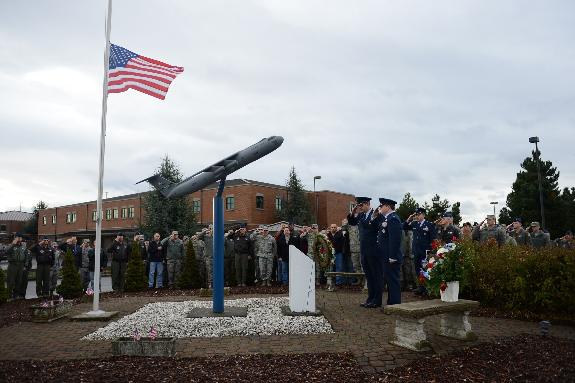 Team McChord Airmen, civilians and retirees gathered Nov. 30, 2012 at Joint Base Lewis-McChord, Wash., to honor the 13 Airmen who were killed when two C-141 Starlifter aircraft collided over north-central Montana in 1992. The ceremony took place at the C-141 memorial site in between the 4th and 8th Airlift Squadron buildings on McChord Field. (U.S. Air Force photo/Staff Sgt. Frances Kriss)