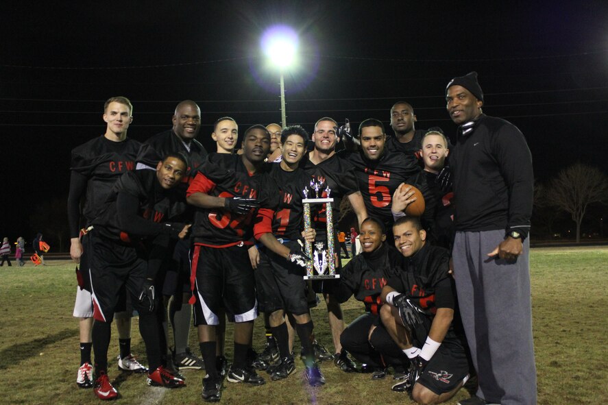 KIRTLAND AFB, N.M. -- On Nov. 15, the combined 377th Comptroller Squadron, 377th Force Support Squadron, 377th Air Base Wing staff agencies and player pool team defeated a combined 377th Weapons System Security Squadron / 377th Security Forces Squadron team 22-14 to become the base’s intramural flag football champions for the second straight year. Team members are, from left to right: (from left to right):SrA Brendan Park, SrA Darius Golson, MSgt Charles Hicks, SrA Victor Gonzales, SrA Shawn Cooper, SSgt Ralphael Bell, SSgt Daniel Wong, SrA Jedidiah Morris, TSgt Michelle Stewart, SSgt Henry Harriel, Mr. Michael Moody, SrA Freddie Meggs, A1C Nicholas Williams, and SMSgt Curtis Green - Coach.(Courtesy photo)