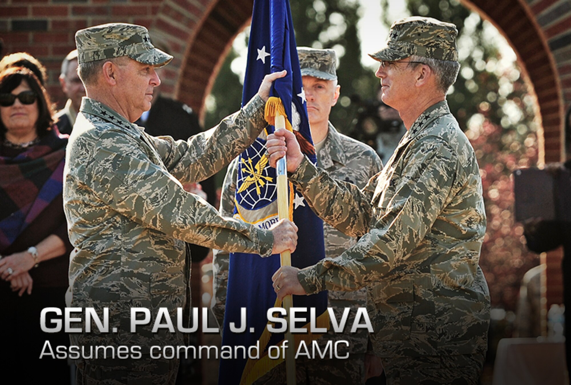 Gen. Paul J. Selva accepts the Air Mobility Command guidon from Gen. Mark A. Welsh III, Chief of staff of the Air Force, during the change of command ceremony at Scott Air Force Base, Ill., Nov. 30, 2012. Selva was previously assigned as the assistant to the Chairman of the Joint Chiefs of Staff in Washington D.C. The outgoing commander, Gen. Raymond E. Johns Jr., served 35 years in the Air Force, commanding more than 130,000 Airmen as well as reaching 4,500 flight hours in various aircraft. (U.S. Air Force photo/Staff Sgt. Ryan Crane) 

