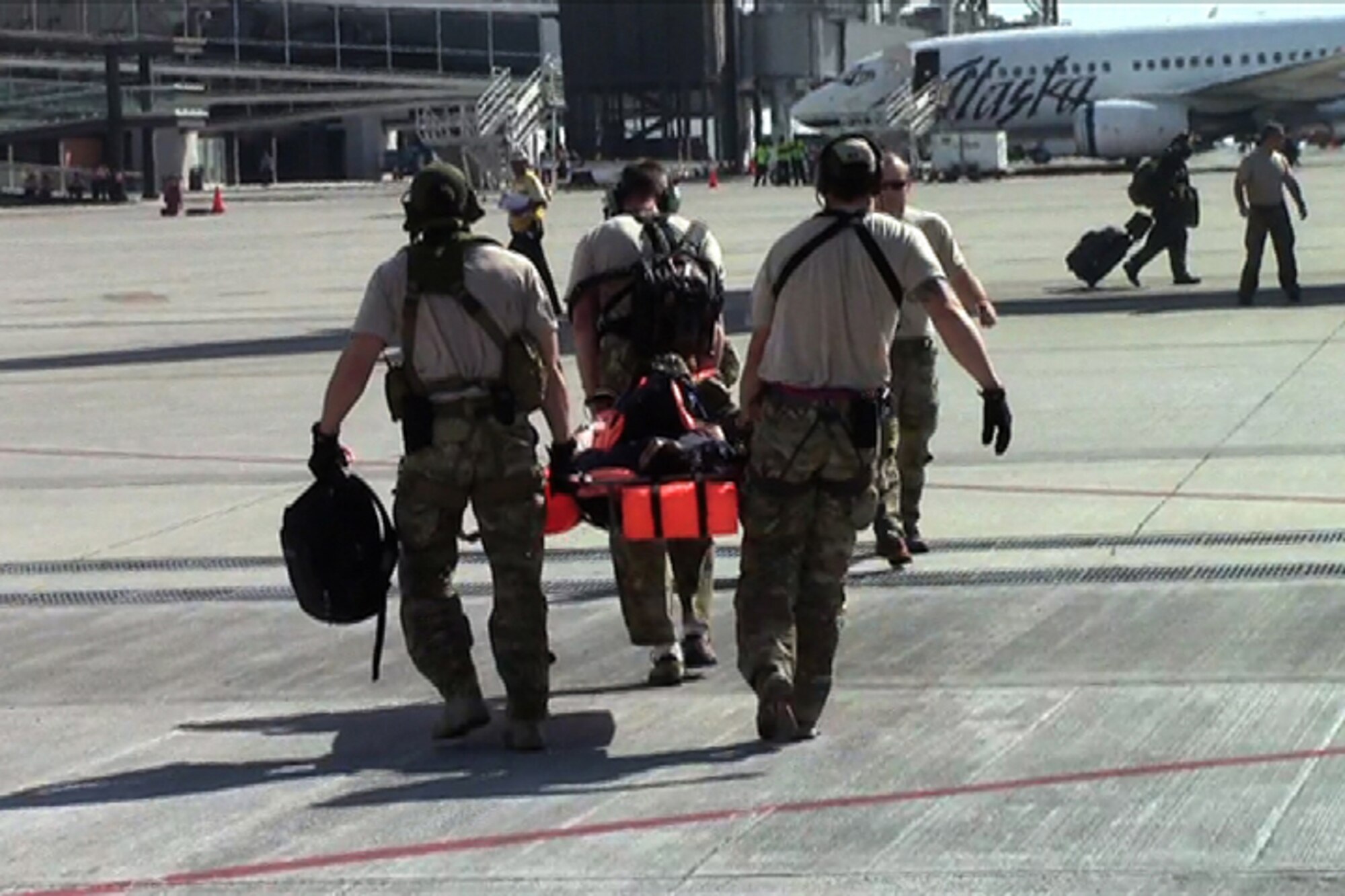 California Air National Guard pararescuemen transfer an injured commercial sailor to an awaiting MC-130P Combat Shadow, Nov. 29, 2012.  Pararescuemen from the 131st Rescue Squadron, Moffett Federal Airfield, Calif. performed the rescue operation 300 miles southwest of the coast of Cabo San Lucas. (photo courtesy by California Air National Guard)