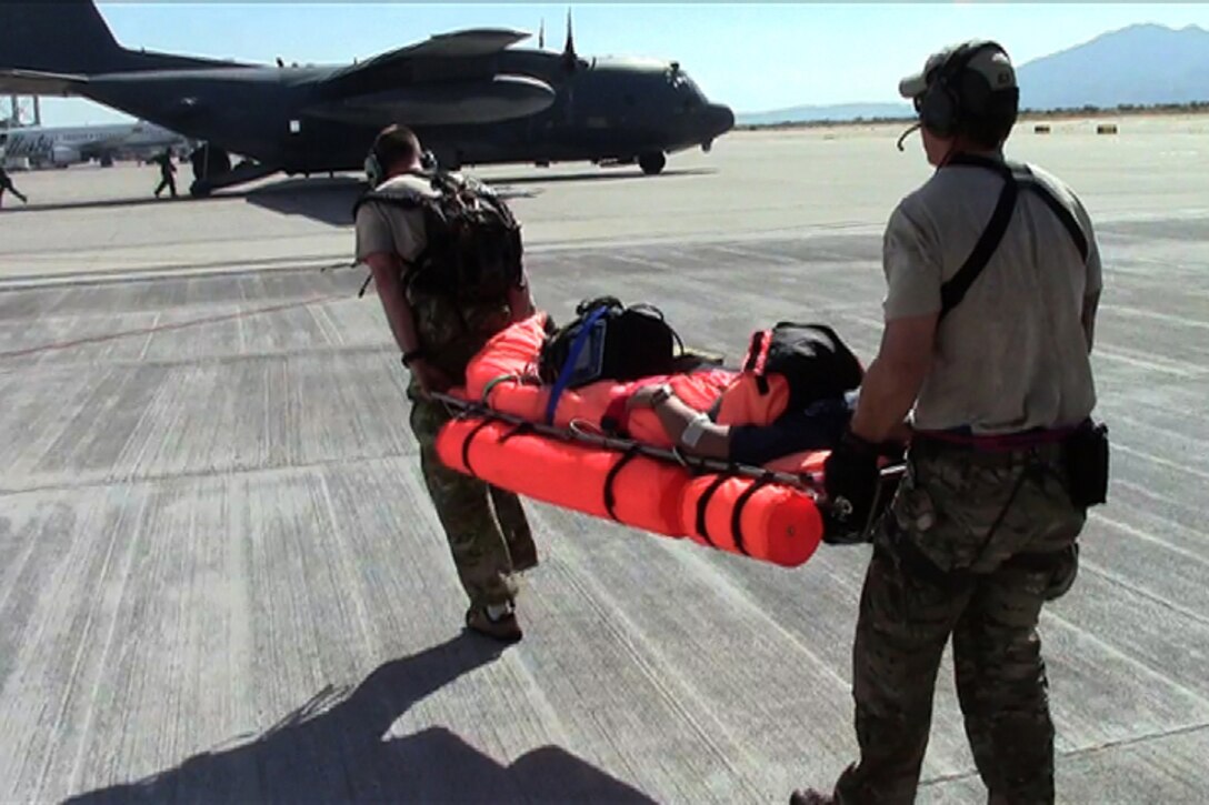 California Air National Guard pararescuemen transfer an injured commercial sailor to an awaiting MC-130P Combat Shadow, Nov. 29, 2012.  Pararescuemen from the 131st Rescue Squadron, Moffett Federal Airfield, Calif. performed the rescue operation 300 miles southwest of the coast of Cabo San Lucas. (photo courtesy by California Air National Guard)