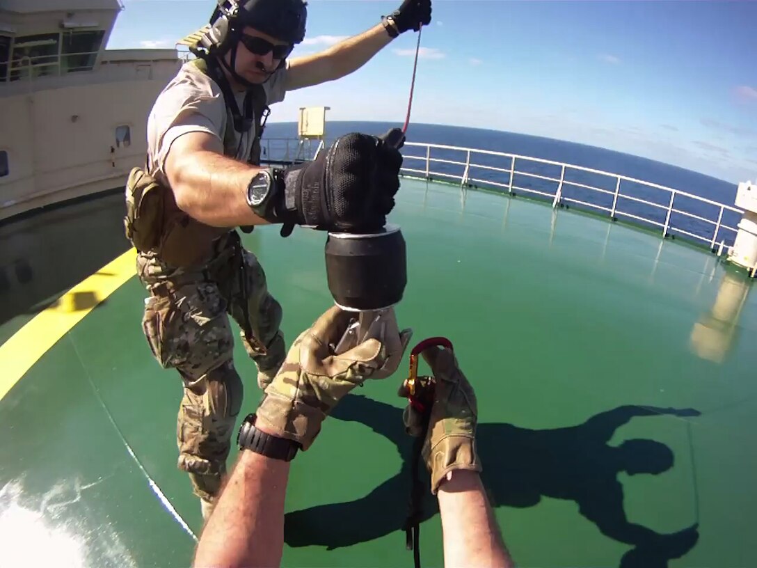 California Air National Guard pararescuemen from the 131st Rescue Squadron hoist down to a merchant vessel, Nov. 29, 2012. The pararescuemen rescued an injured Filipino commercial sailor 300 miles southwest of the coast of Cabo San Lucas. (photo courtesy by California Air National Guard)