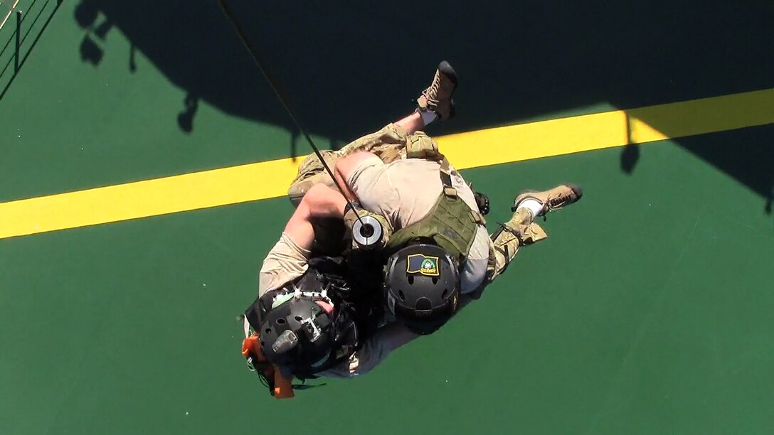 California Air National Guard pararescuemen from the 131st Rescue Squadron hoist down to a merchant vessel, Nov. 29, 2012. The pararescuemen rescued an injured Filipino commercial sailor 300 miles southwest of the coast of Cabo San Lucas. (photo courtesy by California Air National Guard)