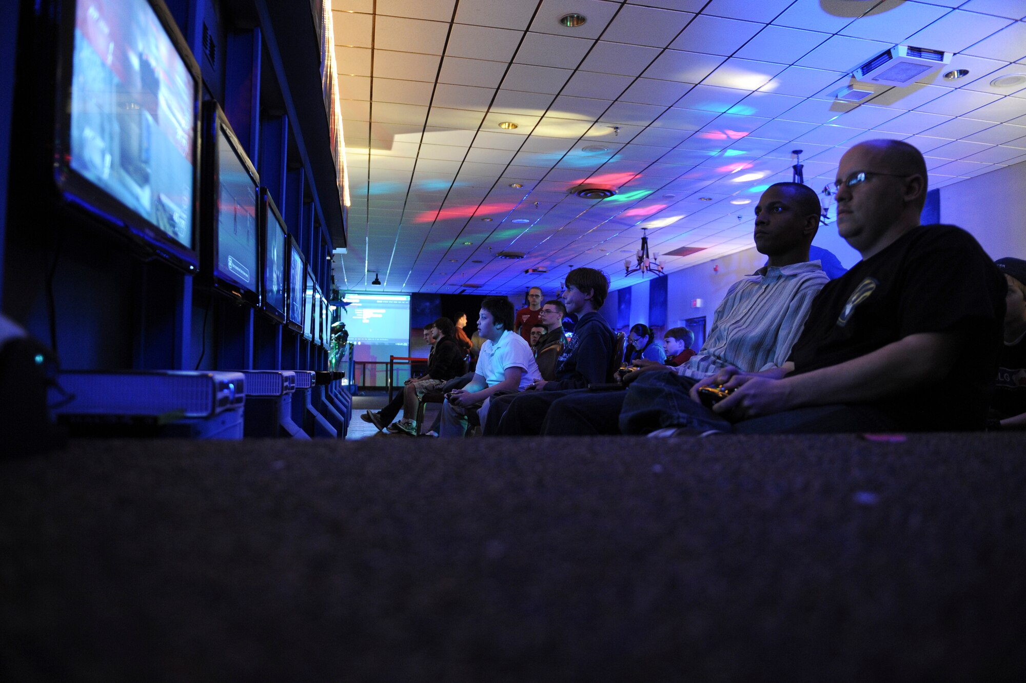 Participants in the Commander?s Cup tournament play a multiplayer first-person shooter video game during Game-Tastic Fest on Barksdale Air Force Base, La., Nov. 16. The Commander?s Cup was a friendly gaming competition between squadrons to boost unit morale. Two Airmen from each squadron were selected to represent their unit to compete for the title. The first place team received a $300 cash prize, the second place received a $200 cash prize and the third place team received a $100 cash prize.(U.S. Air Force photo/Senior Airman Micaiah Anthony) 
