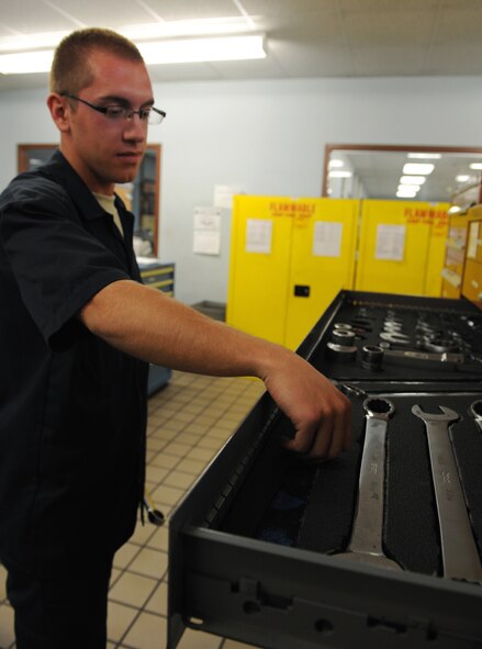 Airman 1st Class Jacob Wilcox, 2nd Logistics Readiness Squadron Vehicle Maintenance Flight general purpose apprentice, places a chip inside a controlled tool kit on Barksdale Air Force Base, La., Nov. 28. Wilcox placed a chit inside the tool box to show the item is currently in use. The 2 LRS VMF materiel control section keeps track of office supplies and tools that are not used on a daily basis by vehicle maintainers. The area is inspected daily to ensure every item is accounted for. (U.S. Air Force photo/Airman 1st Class Benjamin Gonsier)
