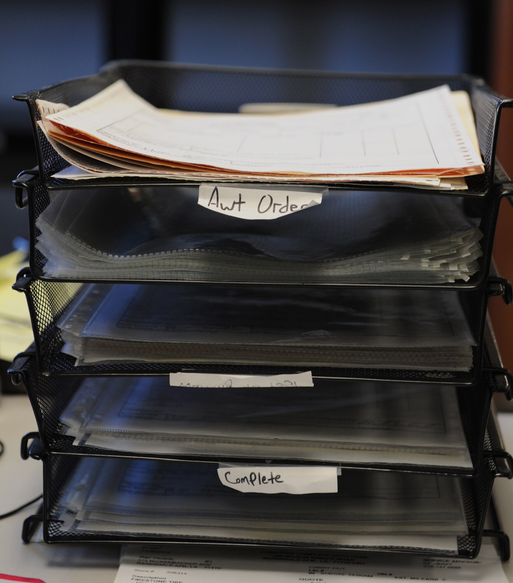Requests and receipts for vehicle maintenance equipment are organized on a desk on Barksdale Air Force Base, La., Nov. 28. Airmen from the 2nd Logistics Readiness Squadron Vehicle Maintenance Flight materiel control section are responsible for ordering the equipment the vehicle maintainers need to do their job. (U.S. Air Force photo/Airman 1st Class Benjamin Gonsier)