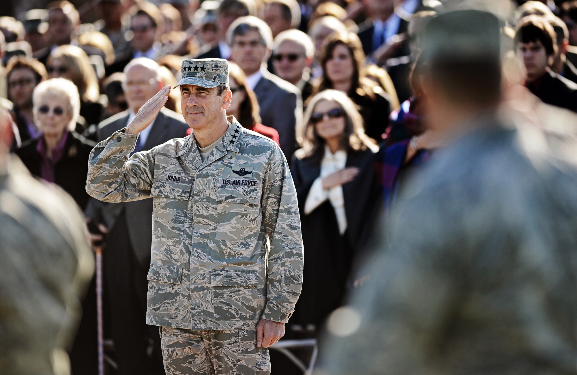 Gen. Raymond E. Johns Jr., Air Mobility Command commander, renders his a final salute as his pass in review during the change of command ceremony at Scott Air Force Base Nov. 30, 2012. Johns served 35 years in the Air Force, commanding more than 130,000 Airmen as well as reaching 4,500 flight hours in various aircraft. The incoming AMC commander, Gen. Paul J. Selva, was previously assigned as the assistant to the Chairman of the Joint Chiefs of Staff in Washington D.C. (U.S. Air Force photo/ Staff Sgt. Ryan Crane)