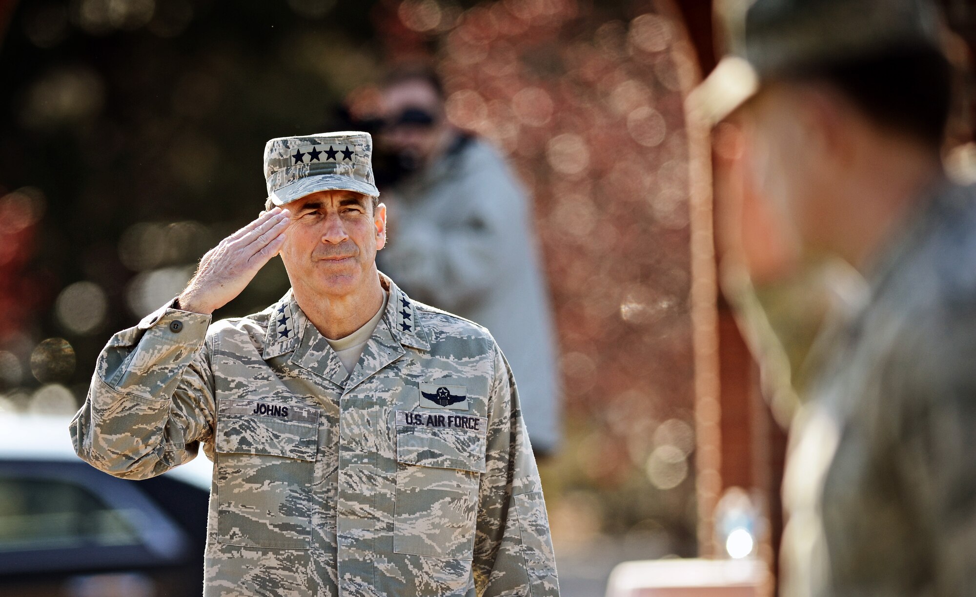 Gen. Raymond E. Johns Jr., Air Mobility Command commander, renders his a final salute as his pass in review during the change of command ceremony at Scott Air Force Base Nov. 30, 2012. Johns served 35 years in the Air Force, commanding more than 130,000 Airmen as well as reaching 4,500 flight hours in various aircraft. The incoming AMC commander, Gen. Paul J. Selva, was previously assigned as the assistant to the Chairman of the Joint Chiefs of Staff in Washington D.C. (U.S. Air Force photo/ Staff Sgt. Ryan Crane)