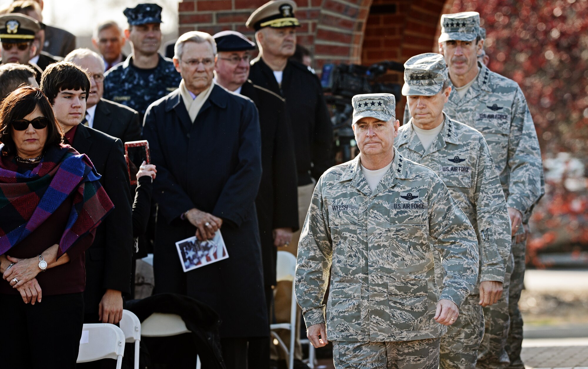 Gen. Mark A. Welsh III, Air Force Chief of Staff, leads the official party during the Air Mobility Command change of command ceremony at Scott Air Force Base, Nov. 30, 2012. Welsh presided over the transition from Gen. Raymond E. Johns Jr. to Gen. Paul J Selva. Johns served 35 years in the Air Force, commanding more than 130,000 Airmen as well as reaching 4,500 flight hours in various aircraft. The incoming AMC commander, Gen. Paul J. Selva, was previously assigned as the assistant to the Chairman of the Joint Chiefs of Staff in Washington D.C. (U.S. Air Force photo/ Staff Sgt. Ryan Crane)